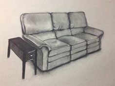 Charcoal drawing showing a couch and side table