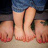 Photograph of a mom and her young boy's feet